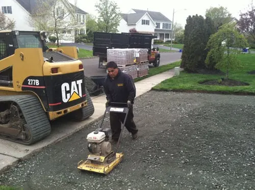 Jay compacting a driveway base